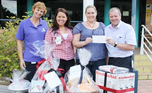 Gayle Rafferty, Dr Hillary Vincent, Nicole Brownlie and Alan Thompson draw the winners of the raffle at Emerald Hospital. Gayle Rafferty, Dr Hillary Vincent, Nicole Brownlie and Alan Thompson draw the winners of the raffle at Emerald Hospital.